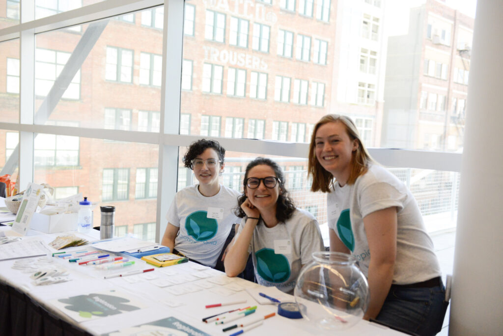 People smiling at registration table